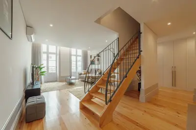 a hallway with a staircase in a house at Heart of Porto Apartments by Vacationy in Porto