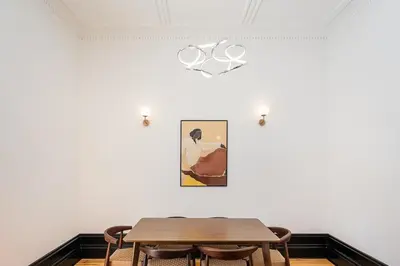 a dining room with a table and a painting on the wall at Terraced Apartment in the Heart of Porto - Free Parking in Porto