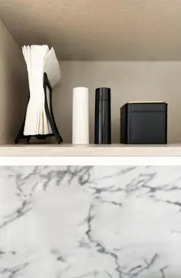 a shelf with a vase and other items on it at MariPinto Downtown Apartment in Porto