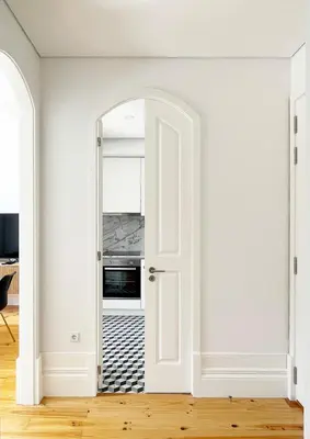 an open door into a kitchen with a stove at MariPinto Downtown Apartment in Porto