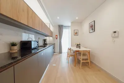 a kitchen with a table and a counter top at Downtown Gold Bolhao by Vacationy in Porto