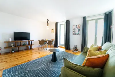 a living room with a couch and a table at Lifestyle at Porto by Upperground in Porto