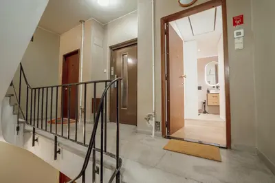 a hallway with a stairway leading to a bathroom at Downtown Premium With Balcony by Vacationy in Porto