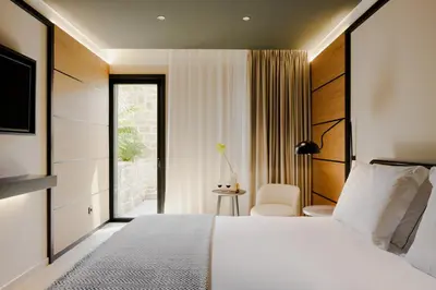 a hotel room with a bed and a window at Porto River Soul Hotel in Vila Nova de Gaia