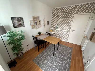 a dining room with a table and a plant at Typical Oporto House in Porto