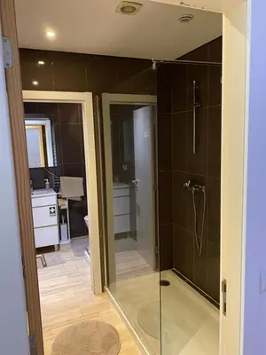 a bathroom with a shower with a glass door at Apartamento Formosa in Porto