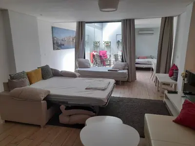 a living room with a couch and a table at Apartamento Formosa in Porto
