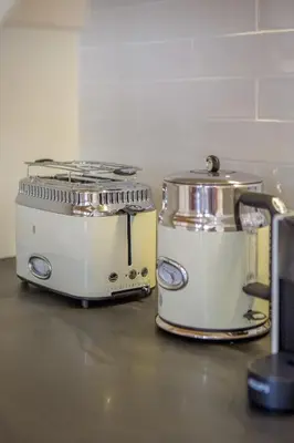 two toasters sitting next to each other on a counter at Almada 151 - 1T in Porto