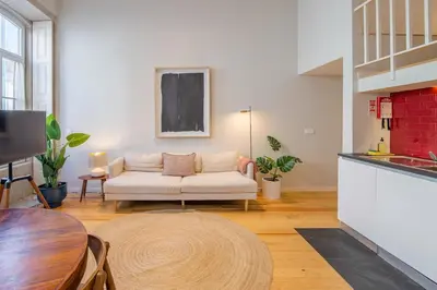 a living room with a couch and a table at Almada 151 - 2F in Porto