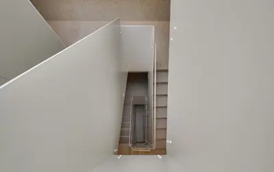 a view of a bathroom through a stair case at Republica 144 Apartamentos by DA'Home in Porto