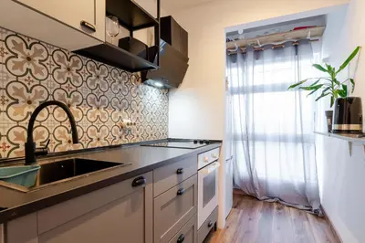 a kitchen with a sink and a counter top at NEW! Gaia Arrabida in Vila Nova de Gaia