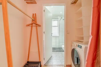 a laundry room with a washer and dryer at NEW! Gaia Arrabida in Vila Nova de Gaia