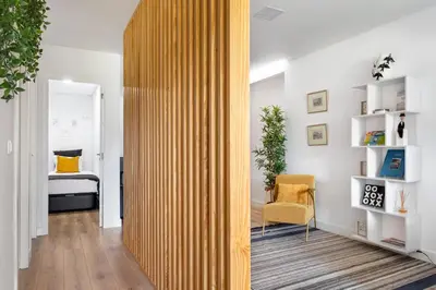 a wooden partition in a room with a bedroom at GuestReady - Fantastic Porto Flat in Porto