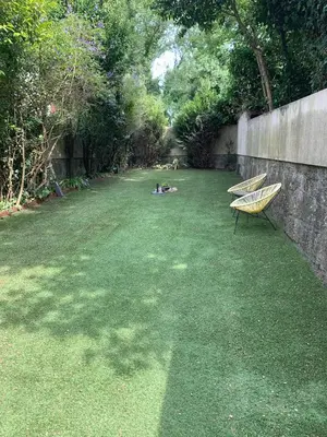 two benches sitting on a lawn in a yard at Wine Cellar by Upperground in Porto