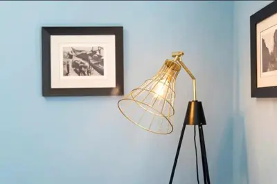a lamp in a room with pictures on the wall at Wine Cellar by Upperground in Porto