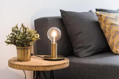 a lamp on a table next to a couch at Modern Invicta by Upperground in Porto