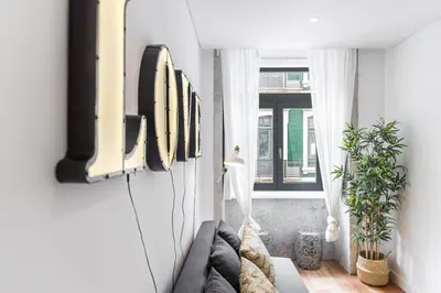 a living room with a couch and a window at Modern Invicta by Upperground in Porto
