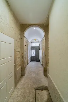 an empty hallway with a door in a building at Cozy Stay w/ AC and View in Porto