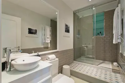 a white bathroom with a sink and a shower at Historical Corner by Upperground in Porto