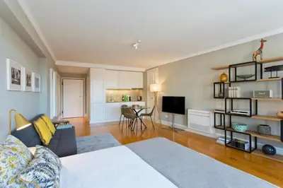 a living room with a bed and a couch and a table at Historical Corner by Upperground in Porto