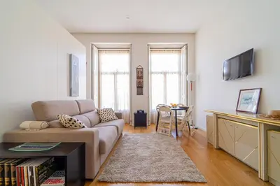 a living room with a couch and a table at Heart of Porto by Upperground in Porto