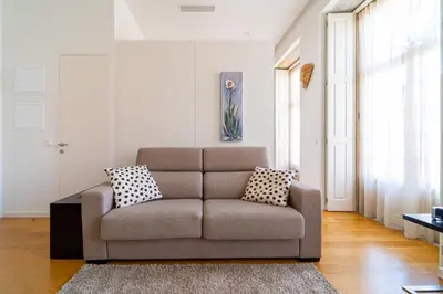 a living room with a couch and a table at Heart of Porto by Upperground in Porto