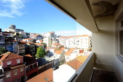 a bathroom with a toilet and a sink and a shower at School Santos Pousada in Porto