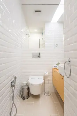 a kitchen with a white counter top and wooden cabinets at Urban Retreat with Balcony, Bright and Central Porto in Porto