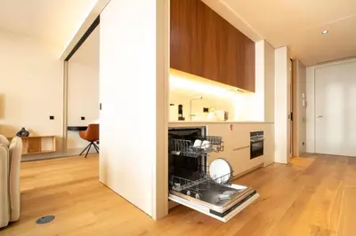 a kitchen with a dish drying rack in a room at Catarina 392 by LovelyStay in Porto