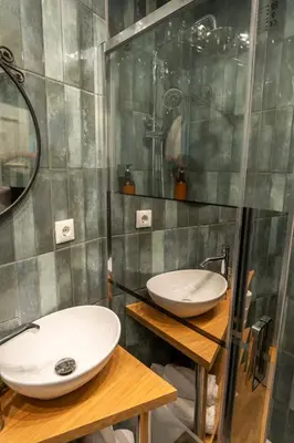 a bathroom with two sinks and a shower at 3BR Flat by Casa da Música, Central, Sleeps 6, E in Porto