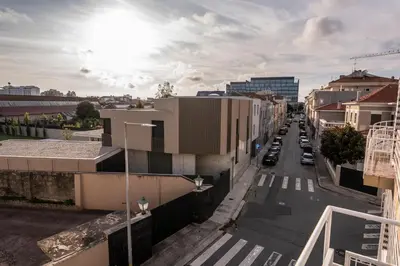 a city street with buildings and cars on the road at 3BR Flat by Casa da Música, Central, Sleeps 6, E in Porto