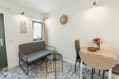 a living room with a couch and a table at Cedofeita Loft by Hosty in Bicas