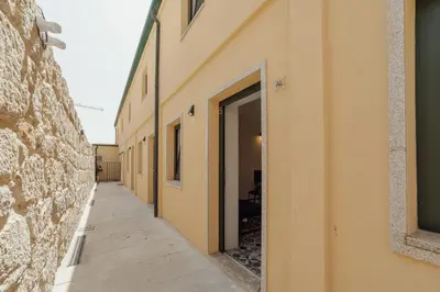 an empty hallway of a building with a doorway at Cedofeita Loft by Hosty in Bicas