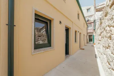 a building with a window on the side of it at Cedofeita Loft by Hosty in Bicas