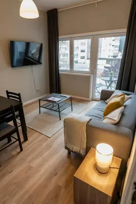 a living room with a couch and a table at 3BR Flat by Casa da Música, Central, Sleeps 6, 2D in Porto