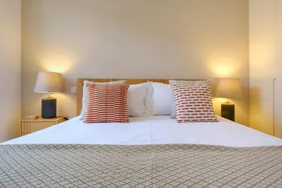 a bedroom with a bed with two pillows on it at Porto Cedofeita Urban Charm Residence in Porto