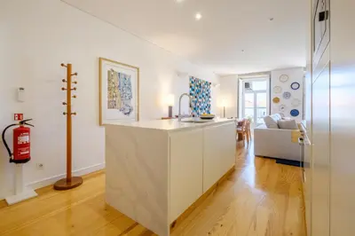 an open kitchen and living room with a fire extinguisher at Porto Cedofeita Urban Charm Residence in Porto