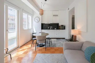 a living room with a couch and a table at Ps70 II in Porto