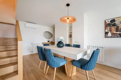 a dining room with a table and blue chairs at GuestReady - Splendid Retreat in Porto in Porto