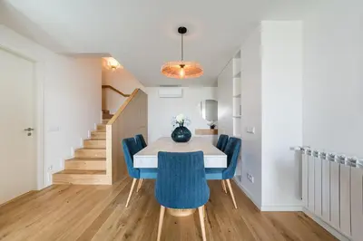 a dining room with a table and blue chairs at GuestReady - Splendid Retreat in Porto in Porto
