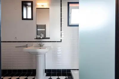 a kitchen with a sink and a counter top at Large Studio with City Views in Porto