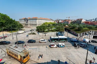 a group of cars and buses in a parking lot at Large Studio with City Views in Porto