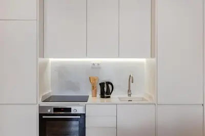 a white washer and dryer in a room at The Morning Light @ BoaVista Flats in Porto