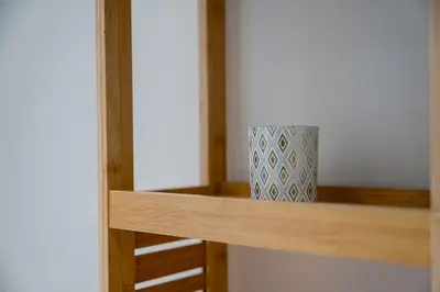 a vase sitting on a shelf in a closet at GuestReady – Steps from Estádio do Dragão in Porto