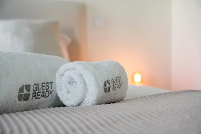 a roll of toilet paper on a bed at GuestReady – Steps from Estádio do Dragão in Porto