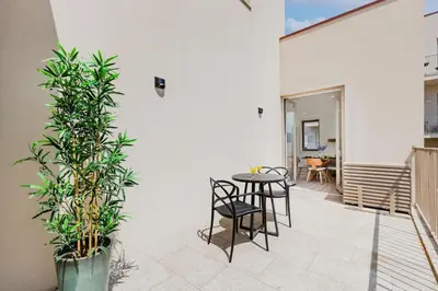 a shower with a shower head in a bathroom at The Sunny Duplex @ BoaVista Flats in Porto