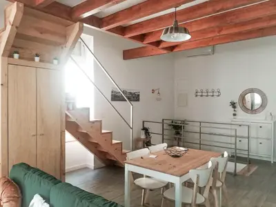 a room with a staircase and a mirror at Mezzanine encantador no Porto in Porto
