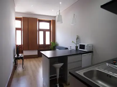 a kitchen with a sink and a counter top at Nidos Accommodation Gaia in Vila Nova de Gaia