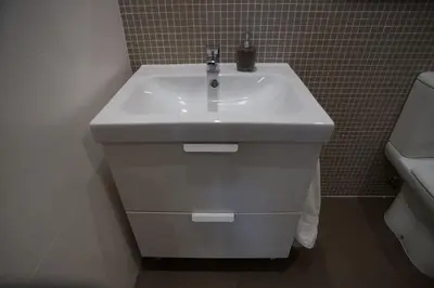 a white sink in a bathroom with a toilet at Nidos Accommodation Gaia in Vila Nova de Gaia