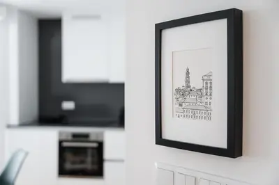 a framed picture of a building on a wall at GuestReady - Relaxing Getaway Near Porto in Vila Nova de Gaia